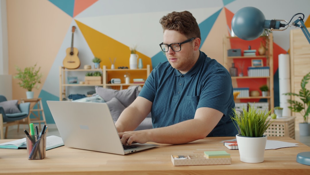 person studying laptop coding home
