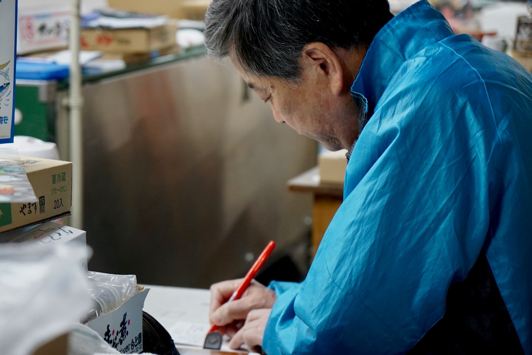 japanese man preparing resume documents
