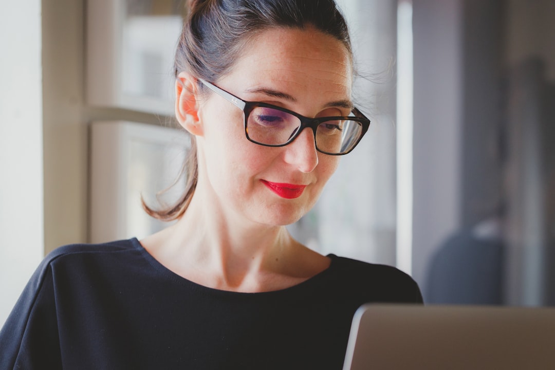 woman reviewing online reviews laptop