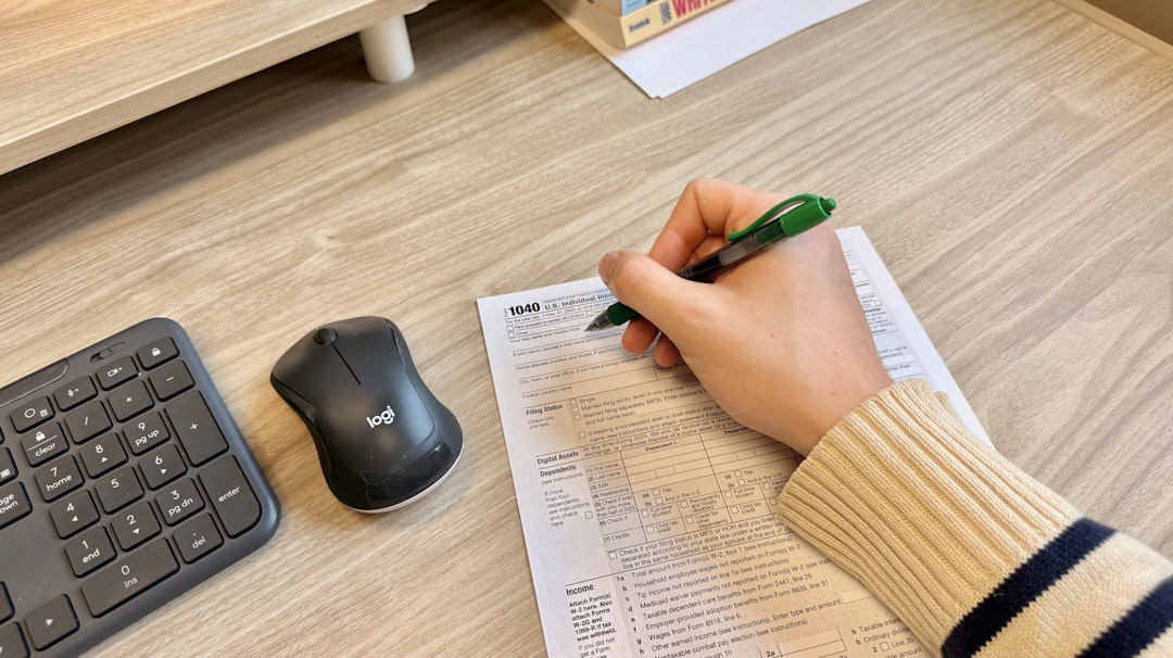japanese man filling out tax form at home