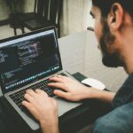 software qa engineer testing laptop