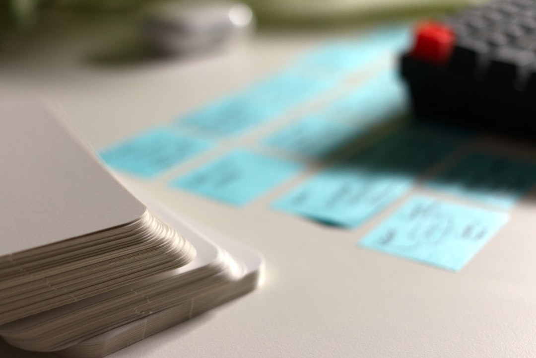 five business cards lined up on desk