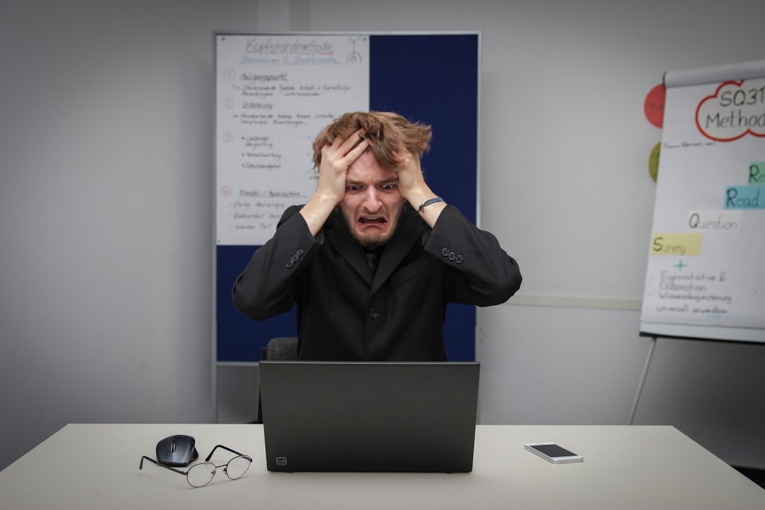 stressed businessman office laptop night