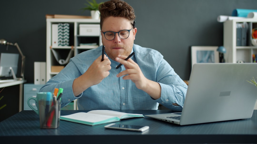 businessman thinking at desk laptop