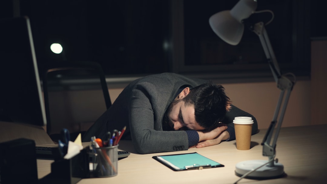 exhausted game developer late night office