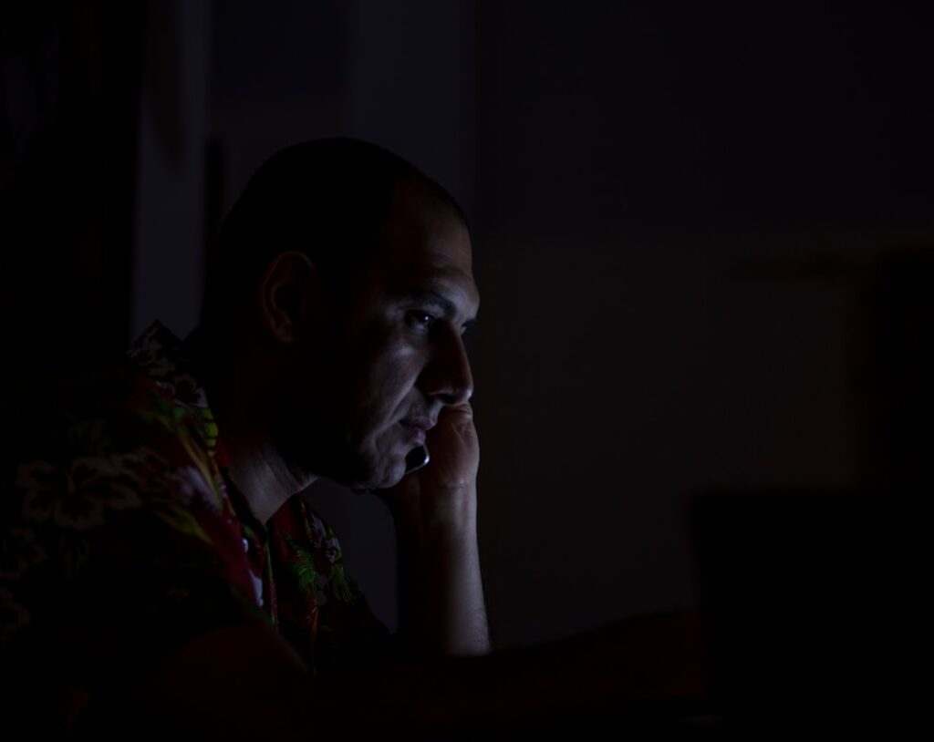 tired businessman late night laptop home study