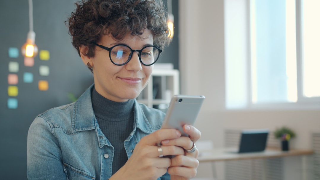 happy person reading review smartphone