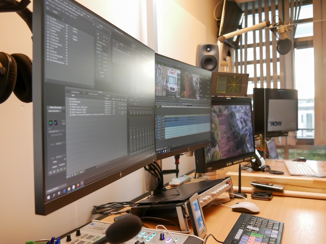 software engineer modern office multiple monitors