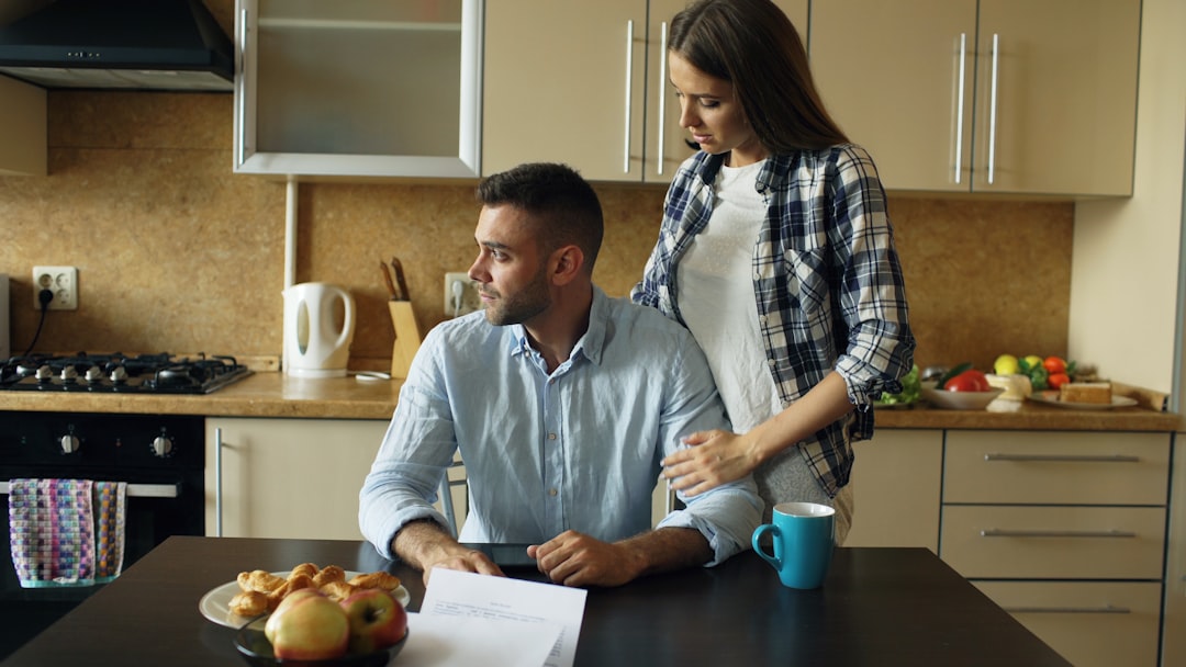 couple kitchen table conversation document