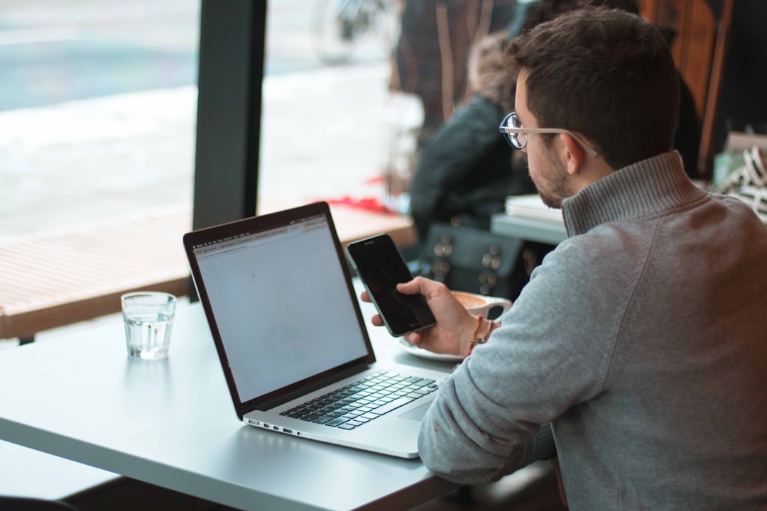 young professional laptop smartphone
