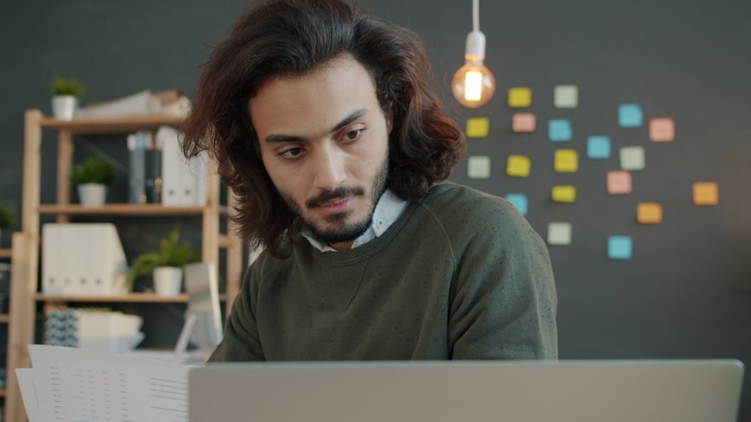 young job seeker looking at laptop