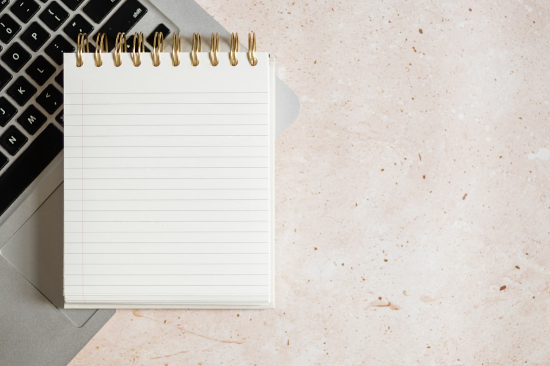 checklist notebook with pen on desk