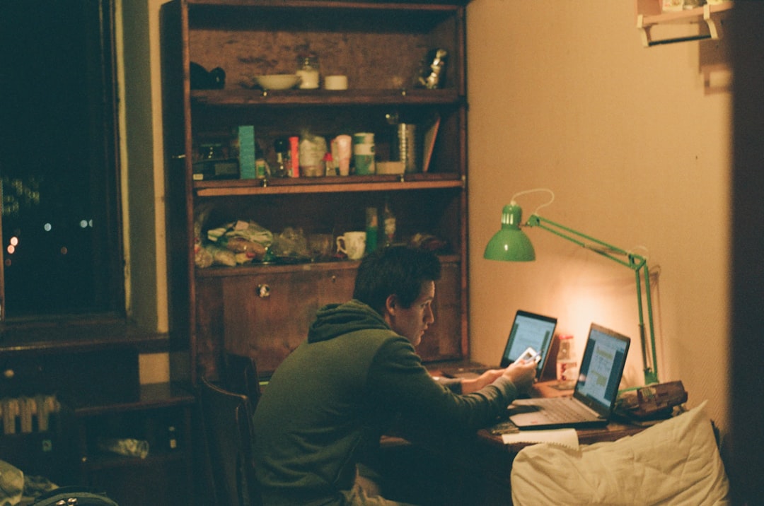 father studying late night laptop
