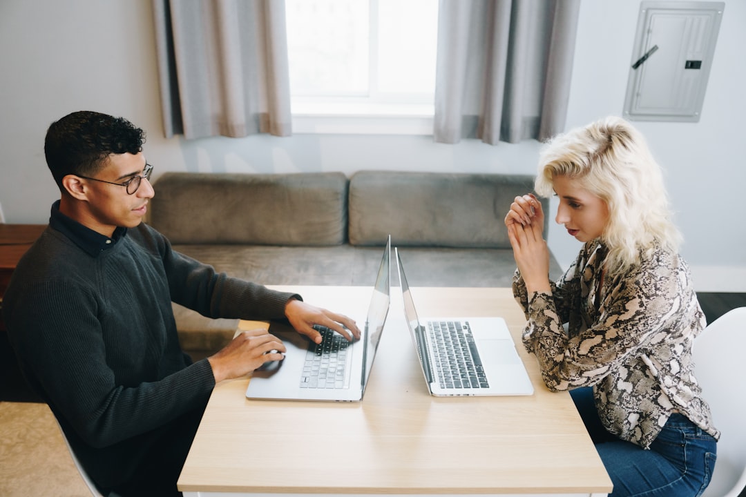 couple discussion home laptop