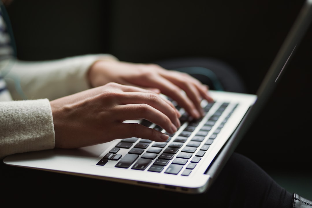 person typing laptop late night