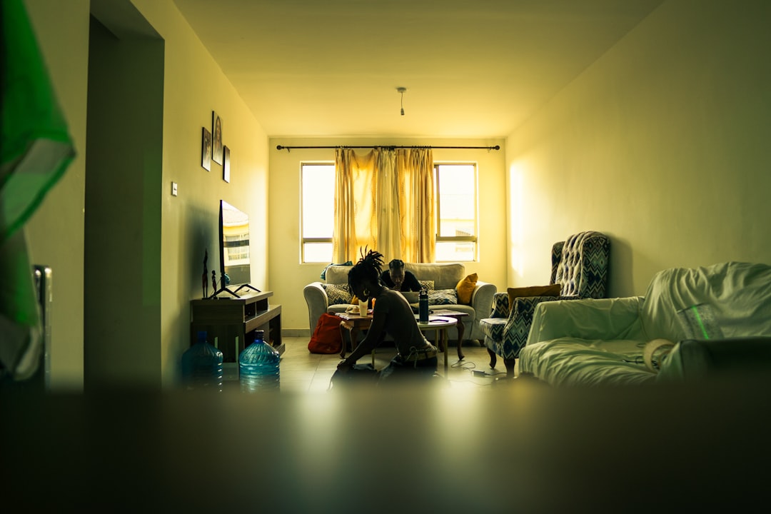japanese man smartphone night living room