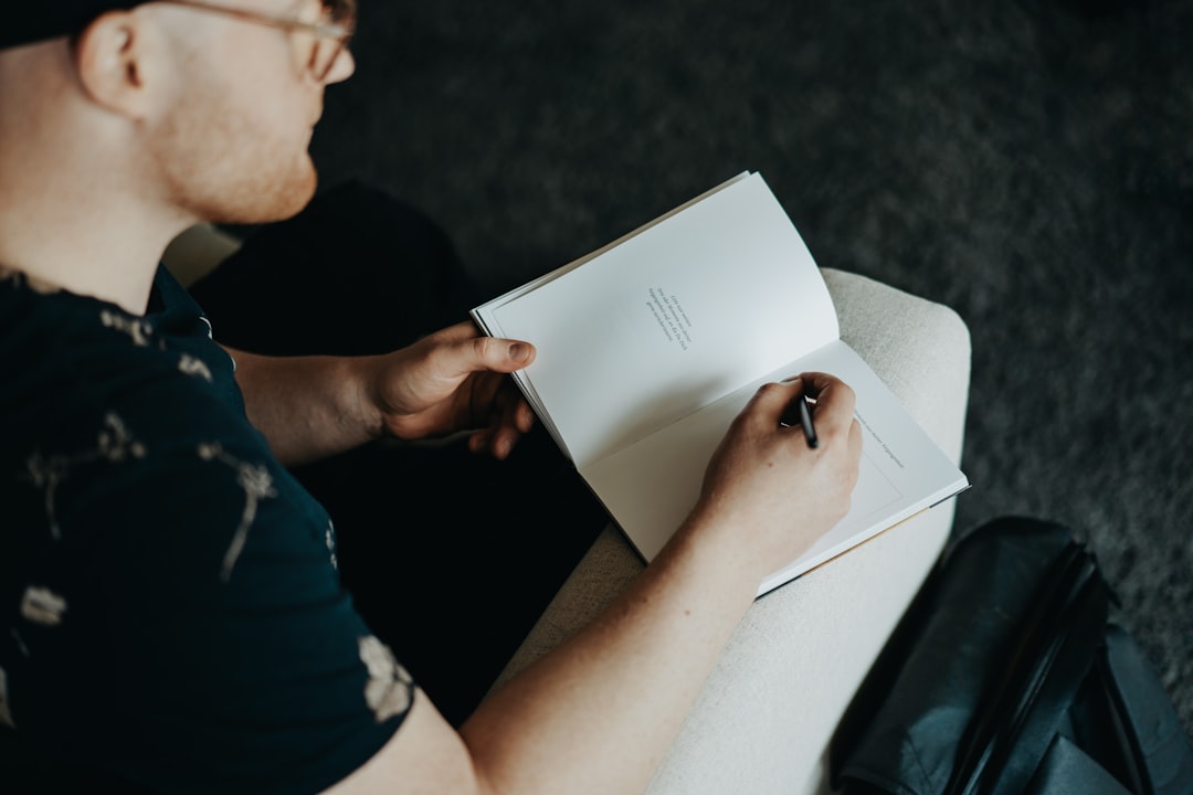 thoughtful man notebook reflection journal