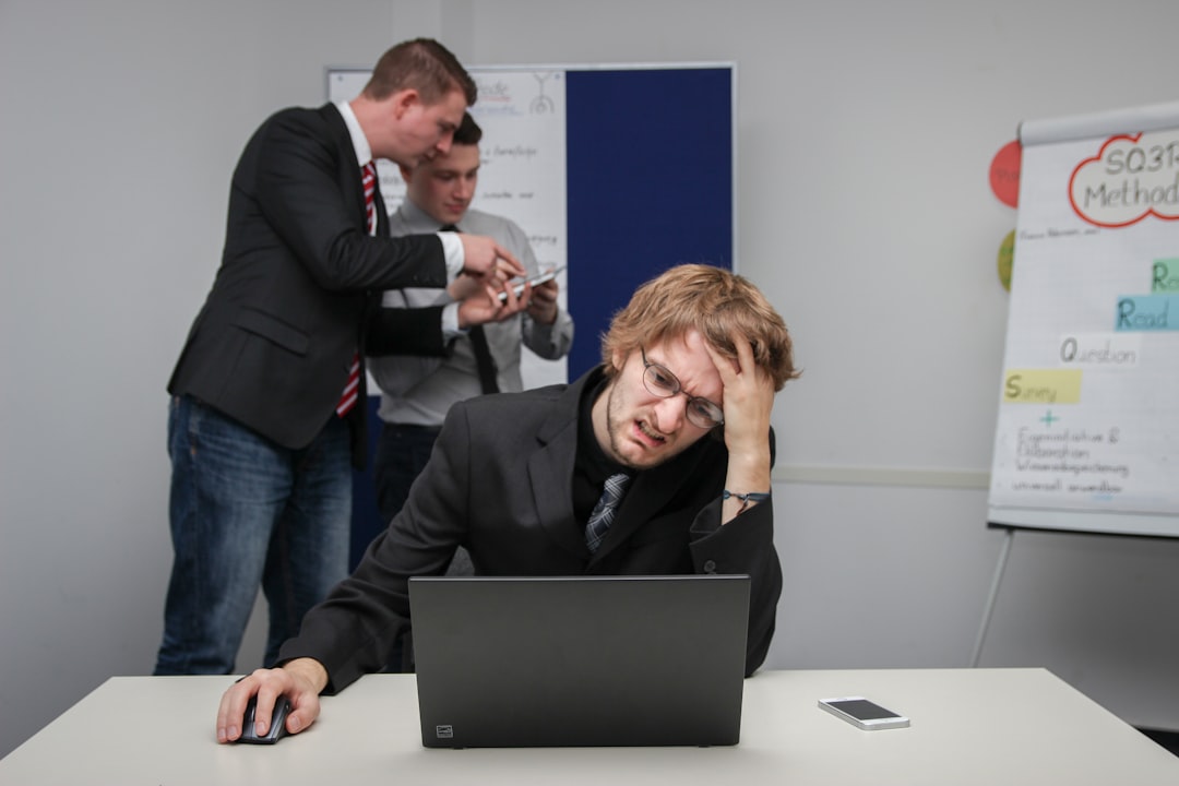 office worker hiding laptop screen