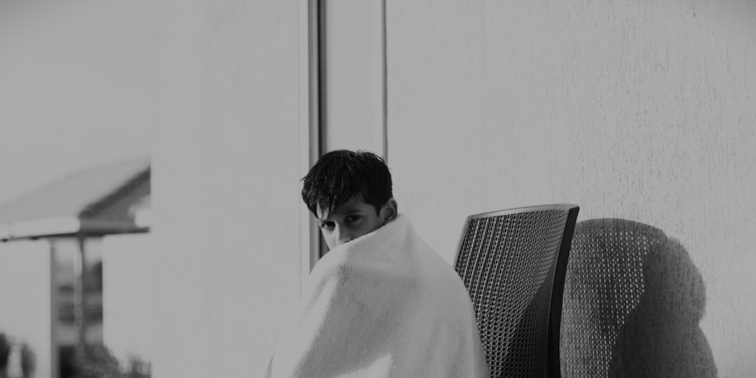 tired japanese businessman in his thirties looking out window