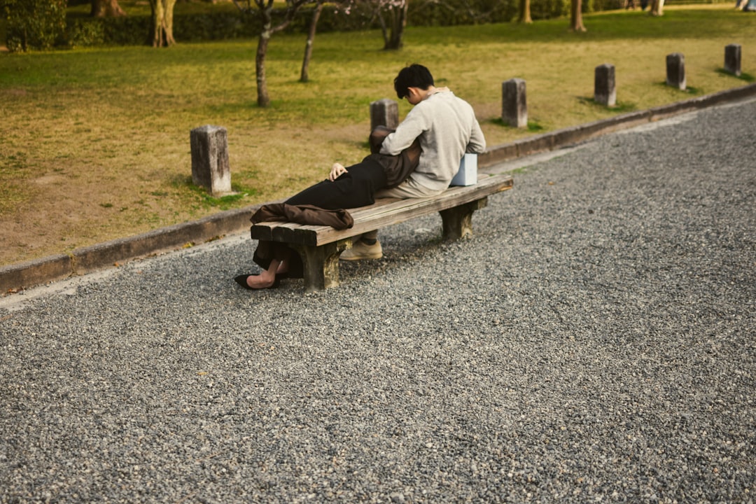 japanese man relaxing weekend park