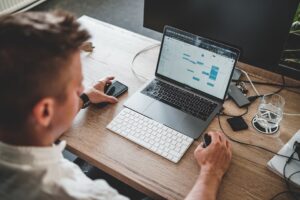data scientist working laptop office