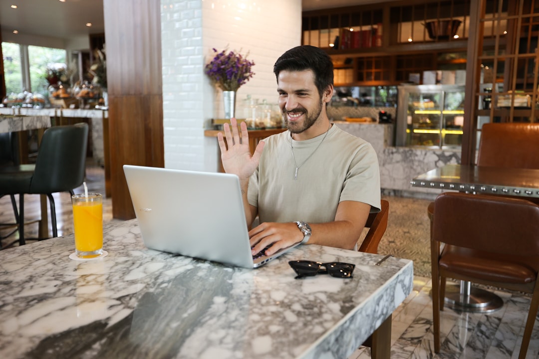 businessman frustrated laptop video meeting