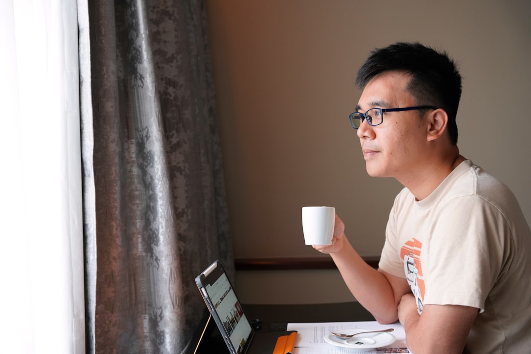 japanese man restart laptop coffee calm morning