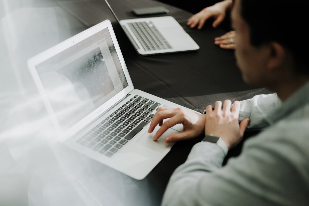 business person comparing online courses laptop