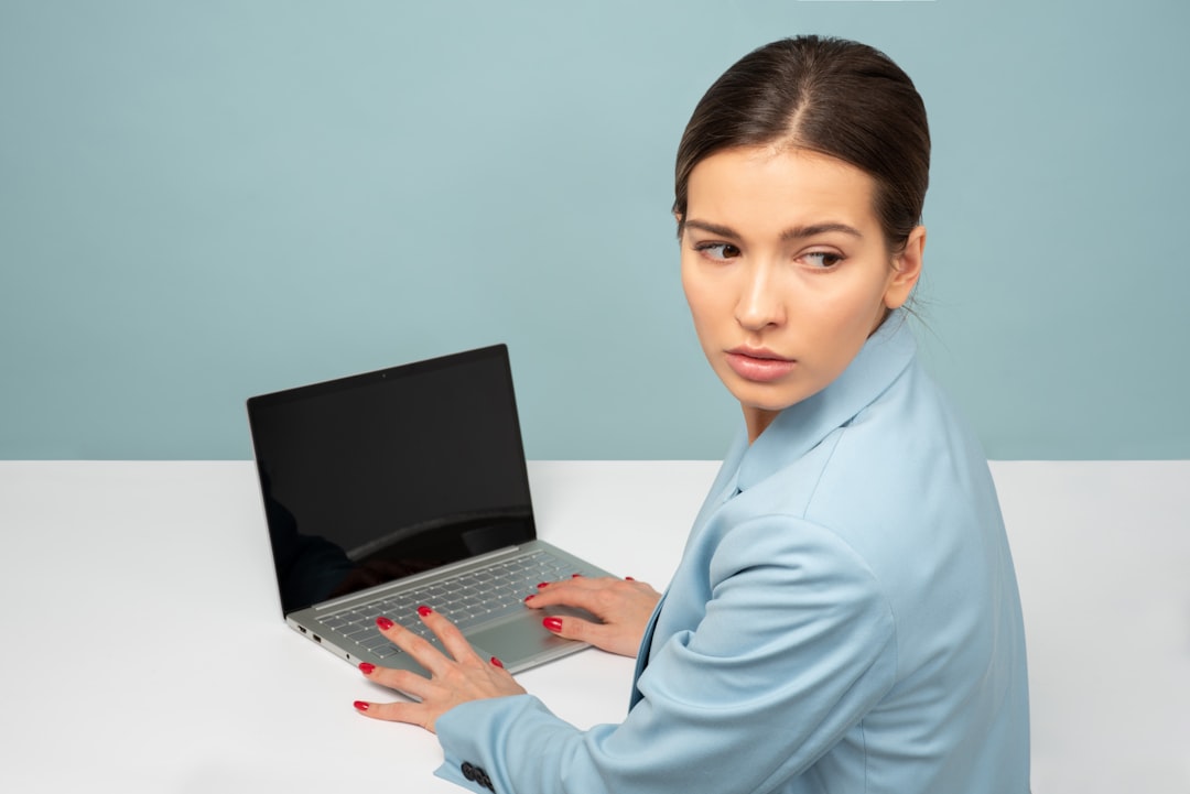 business person comparing options on laptop