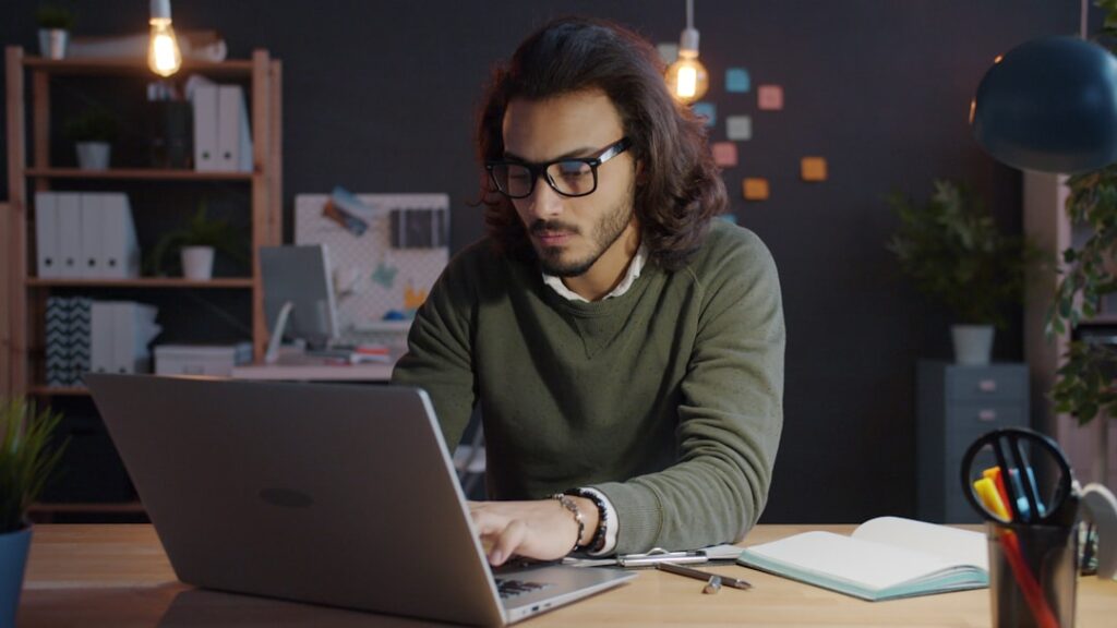 japanese businessman working laptop night home office