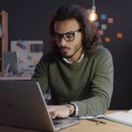 japanese businessman working laptop night home office