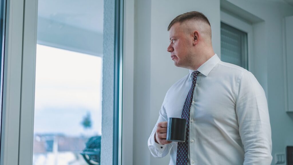 businessman morning routine sunrise window coffee