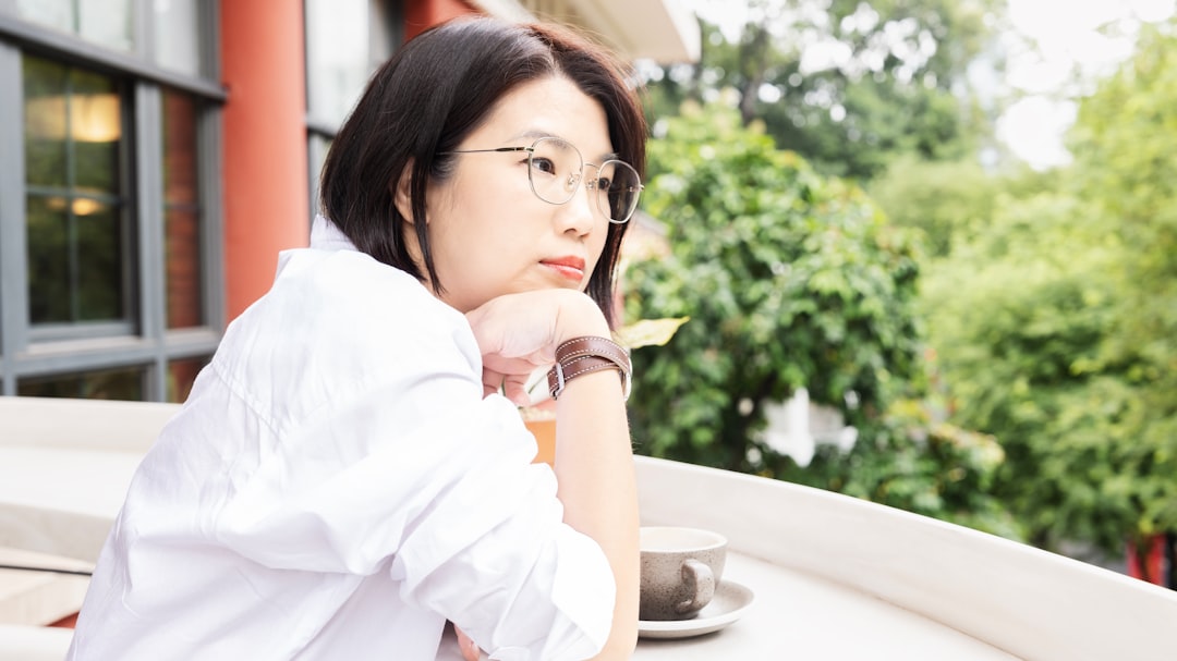japanese woman office worker thinking desk