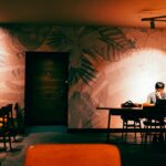 japanese woman studying laptop night cafe