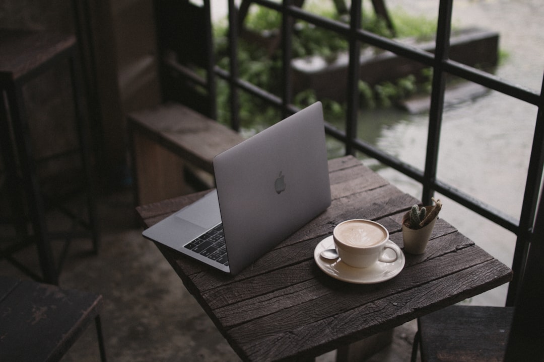 early morning laptop coffee desk window