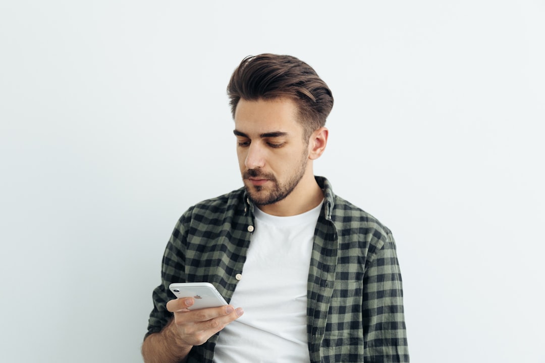 disappointed person looking at phone
