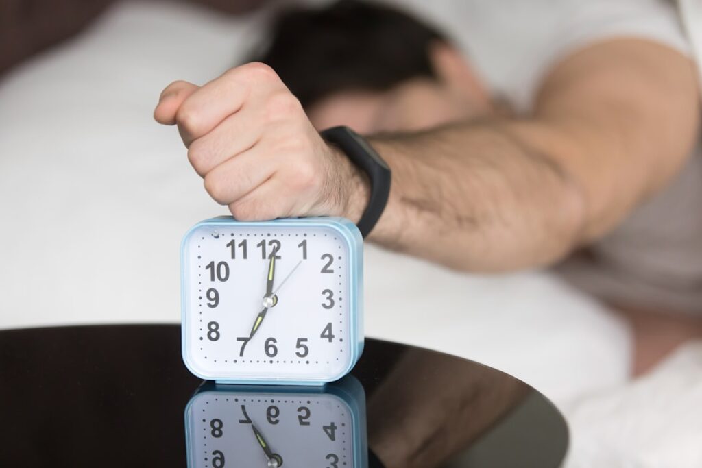 tired businessman morning alarm clock