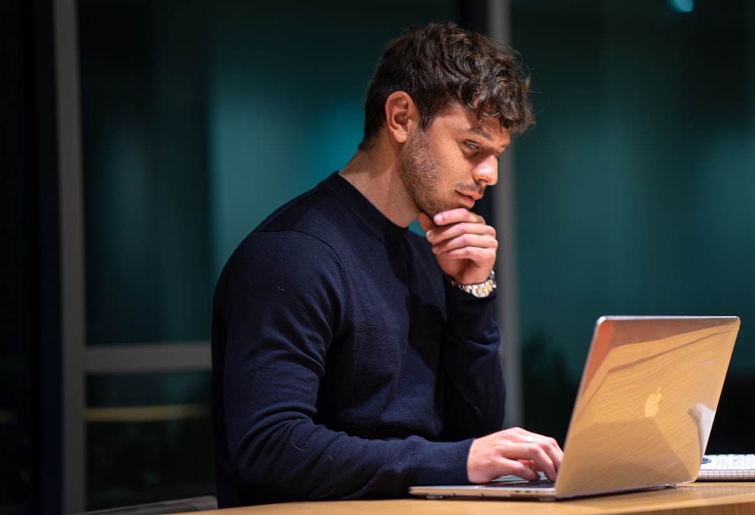 office worker thinking laptop