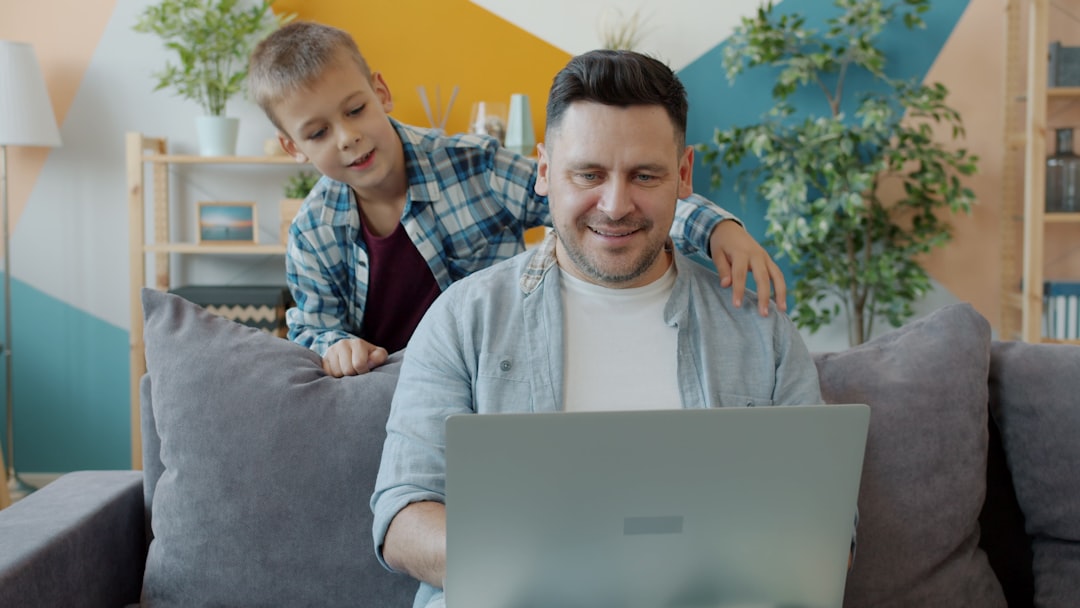 happy father working laptop home