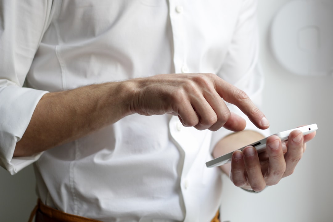 businessman checking smartphone email notifications