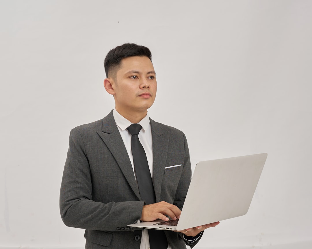 japanese man choosing job offers laptop