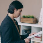 japanese businessman studying licensed professional books desk