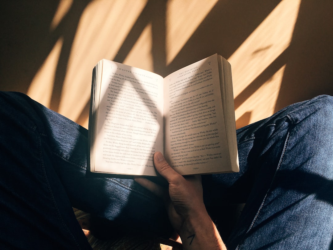 man reading book morning sunlight