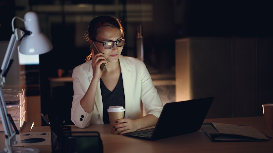 businessman studying laptop night desk