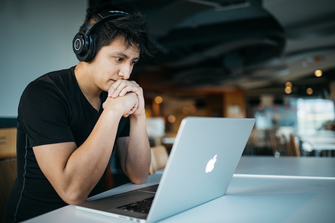 focused person studying online laptop