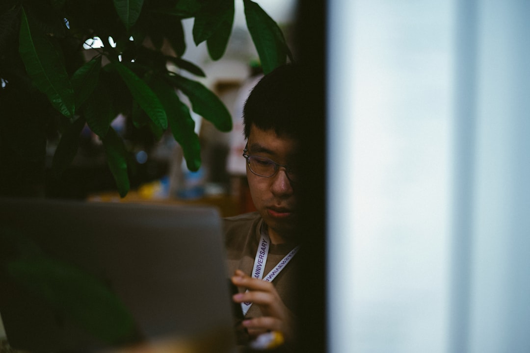 japanese businessman using laptop confident