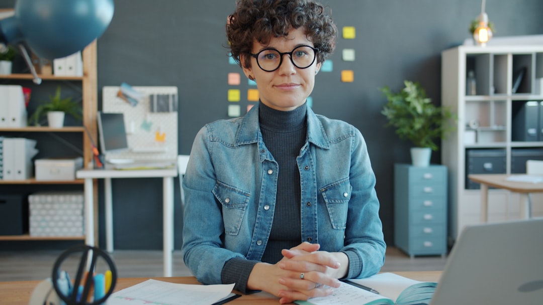 woman writing notebook confident workspace