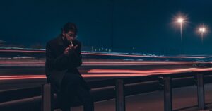 businessman smartphone night city