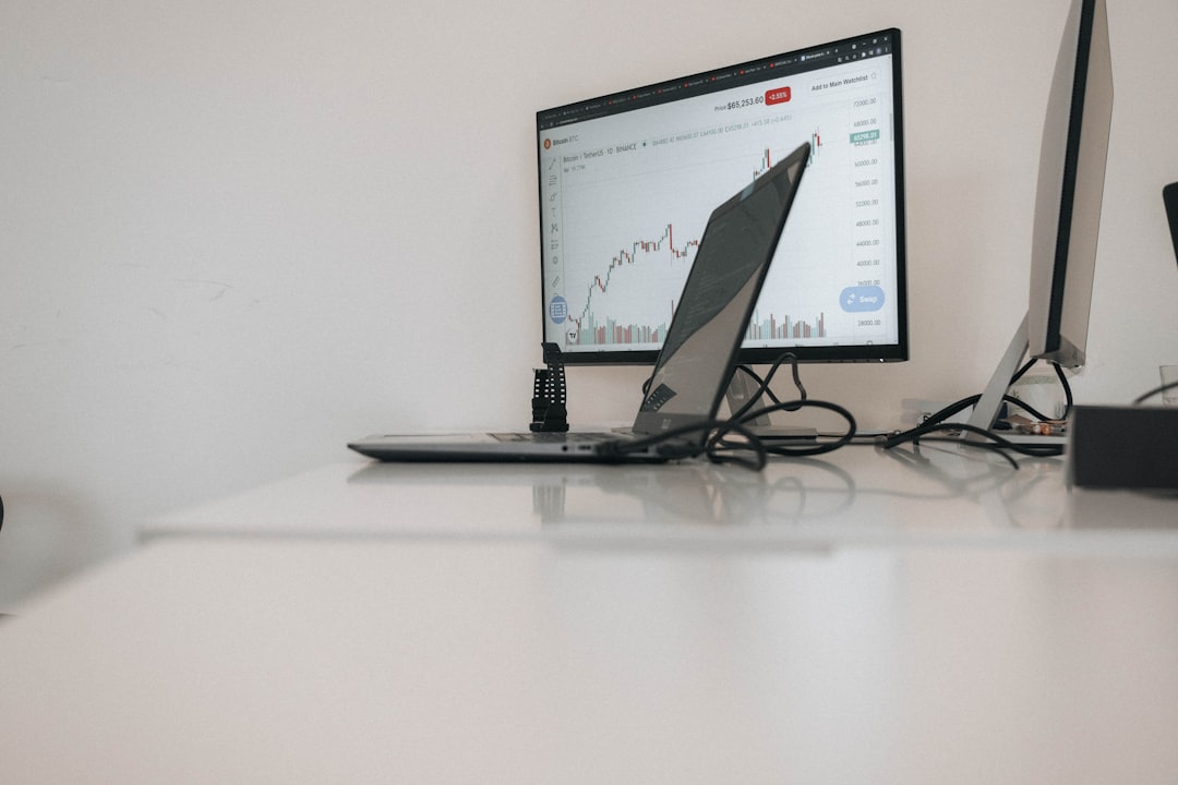 comparison chart on laptop screen office desk