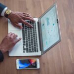 businessman making powerpoint slides laptop